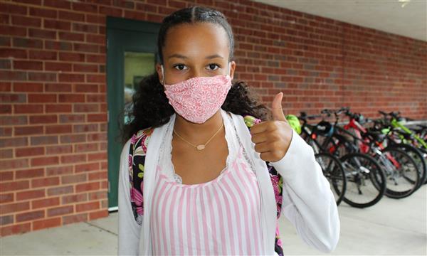 student smiles on first day of school